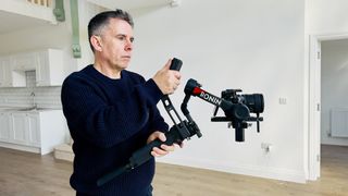 DJI RS 4 Pro gimbal with a camera attached in use