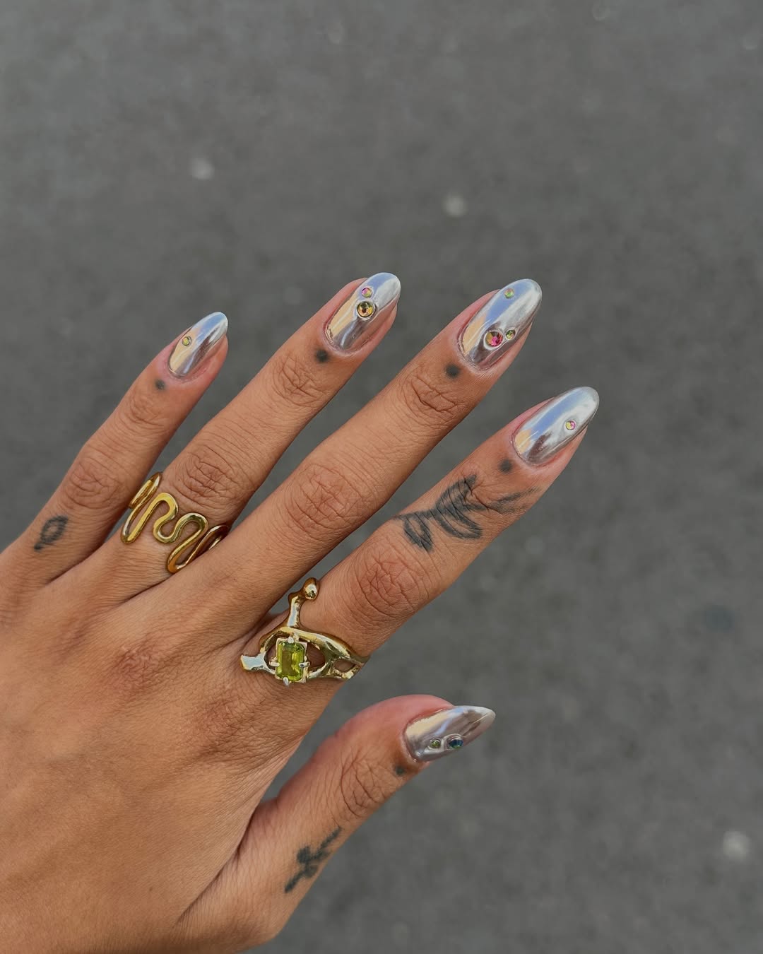 silver nails with chrome and gems