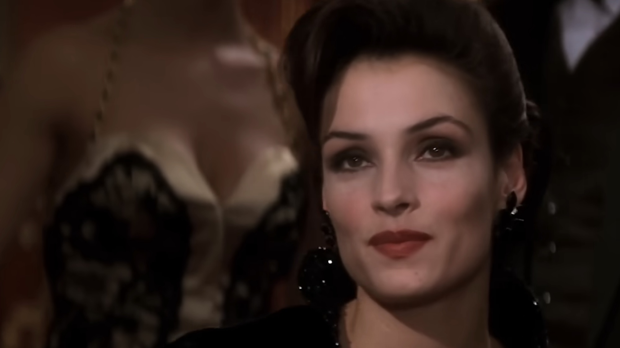 Xenia smiling meeting James Bond in Goldeneye. 
