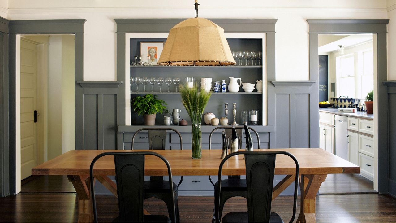 Wooden dining room table and chairs with large hanging lampshade - for article on how to clean a dining room