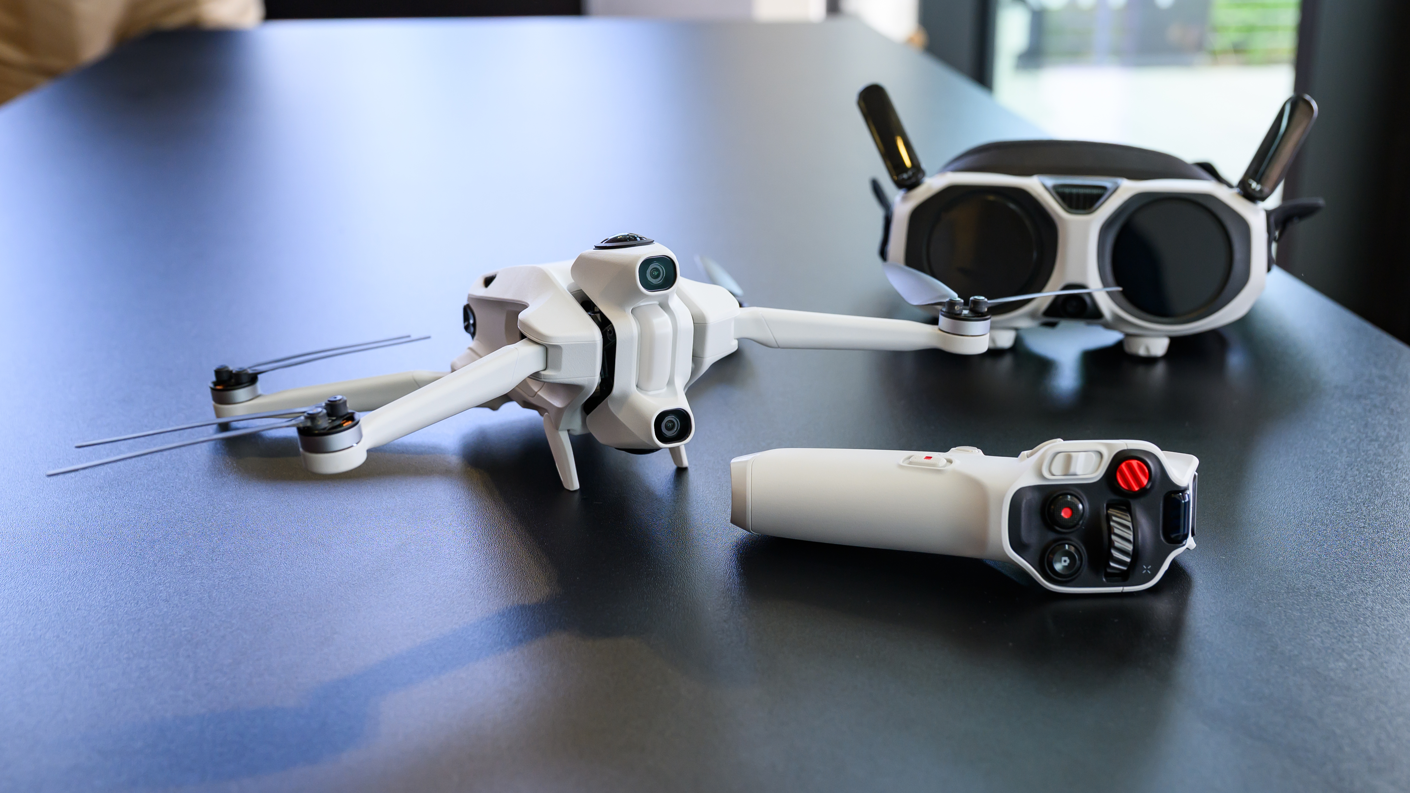 The Antigravity A1 and its accessories on a table
