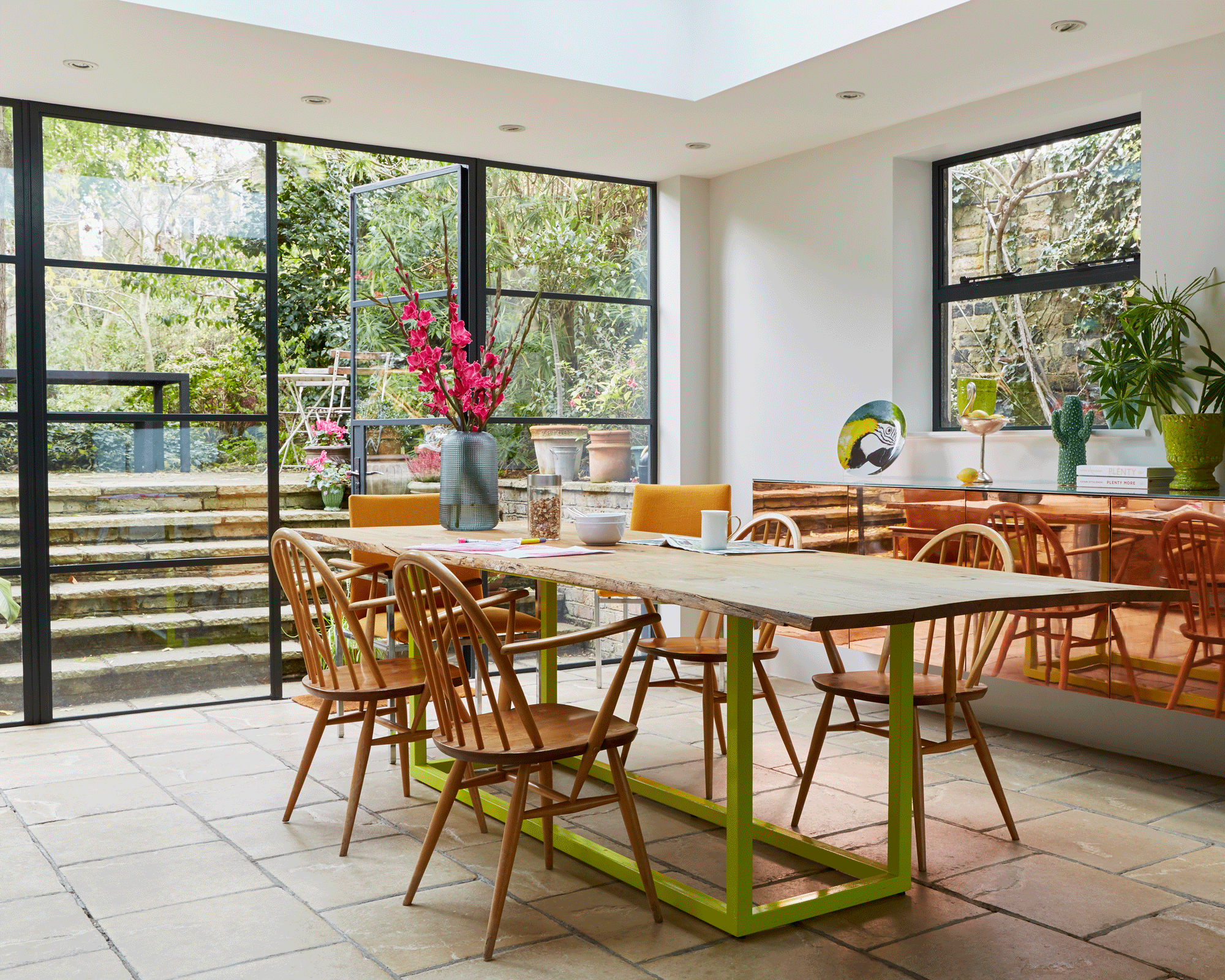 How to plan an additional basement extension with dining table and chairs overlooking the garden