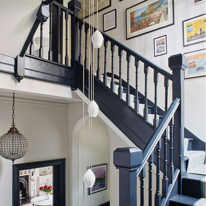 stairway lighting black staircase with droplet pendant light