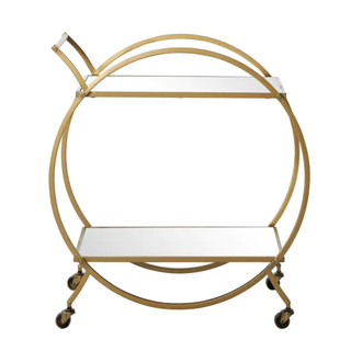 A round gold bar cart with mirror shelves
