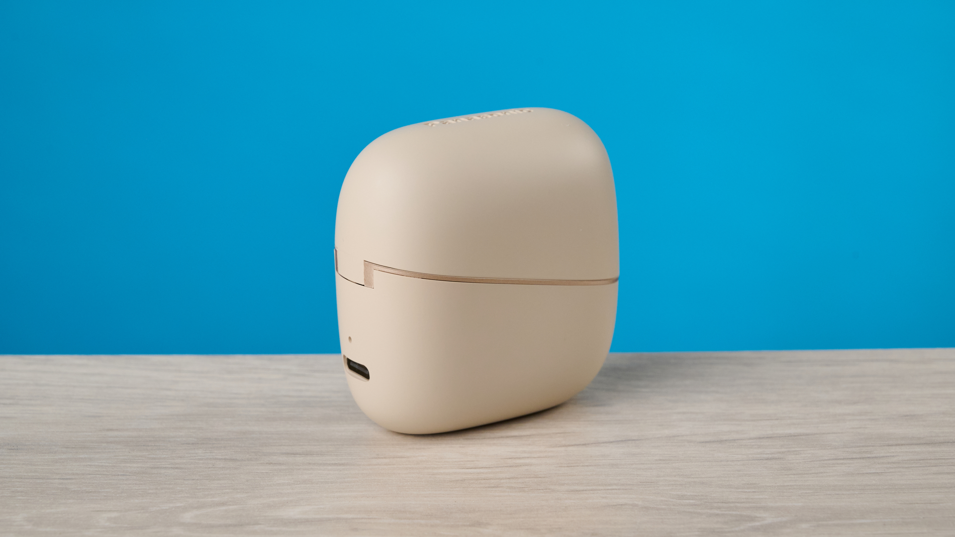 Panasonic RB-F10 in beige photographed in front of a blue background