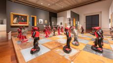 A giant chess set made in Africa covers a gallery floor at the Toledo Museum of Art