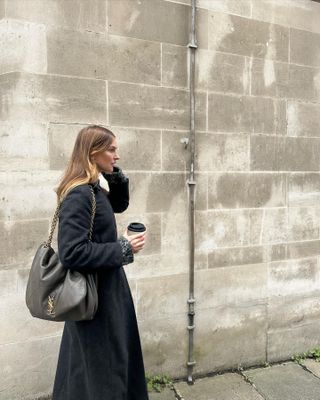 Camille Charriere carrying a slouchy Saint Laurent handbag