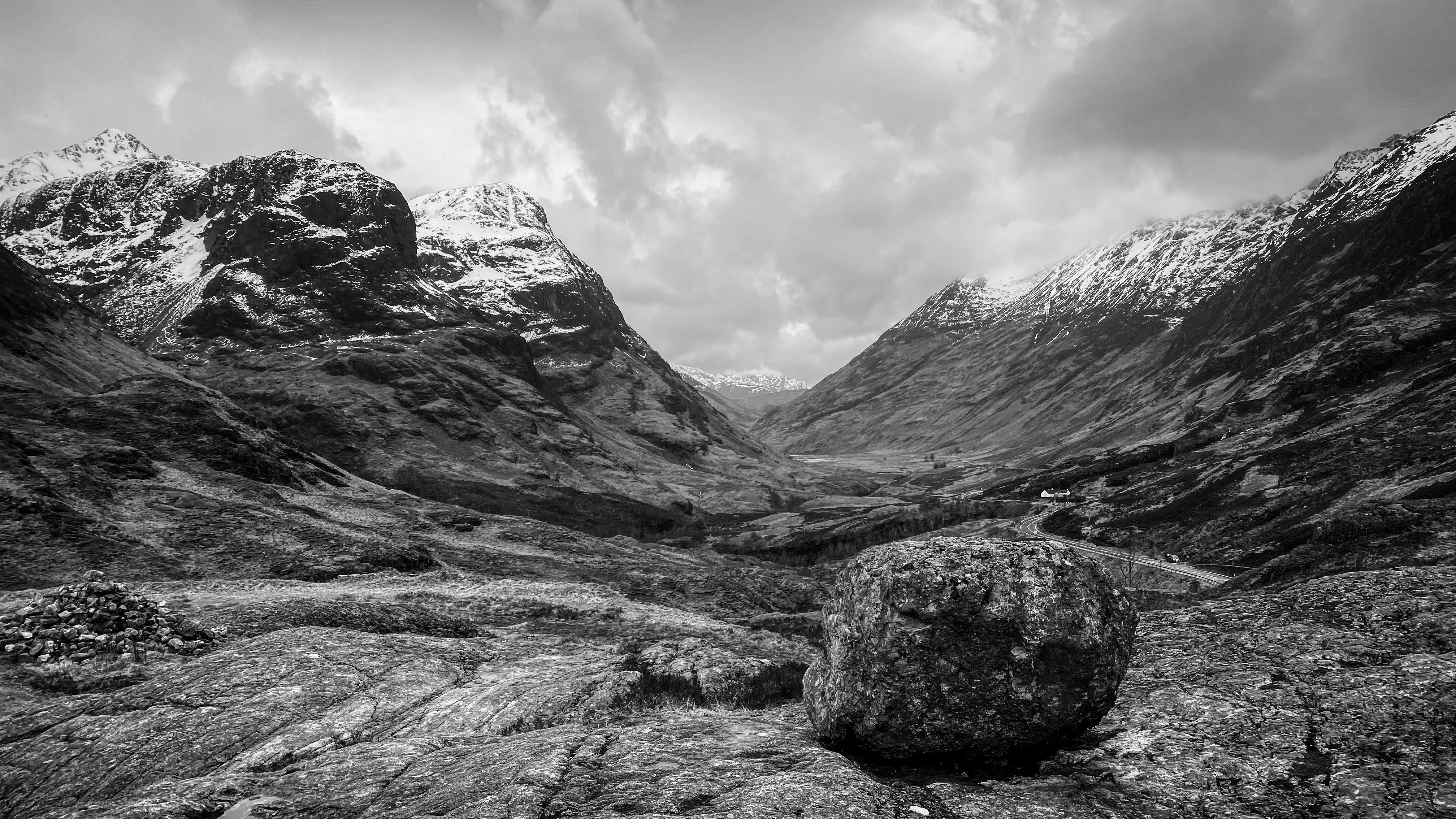 A landscape photo of a mountain in black and white