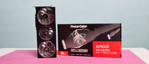 An AMD Radeon RX 7900 GRE from PowerColor on a desk with its retail packaging