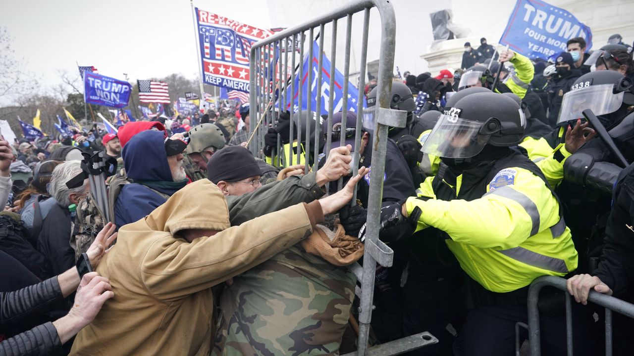 Jan. 6 rioters try to break through police barrier outside the U.S. Capitol