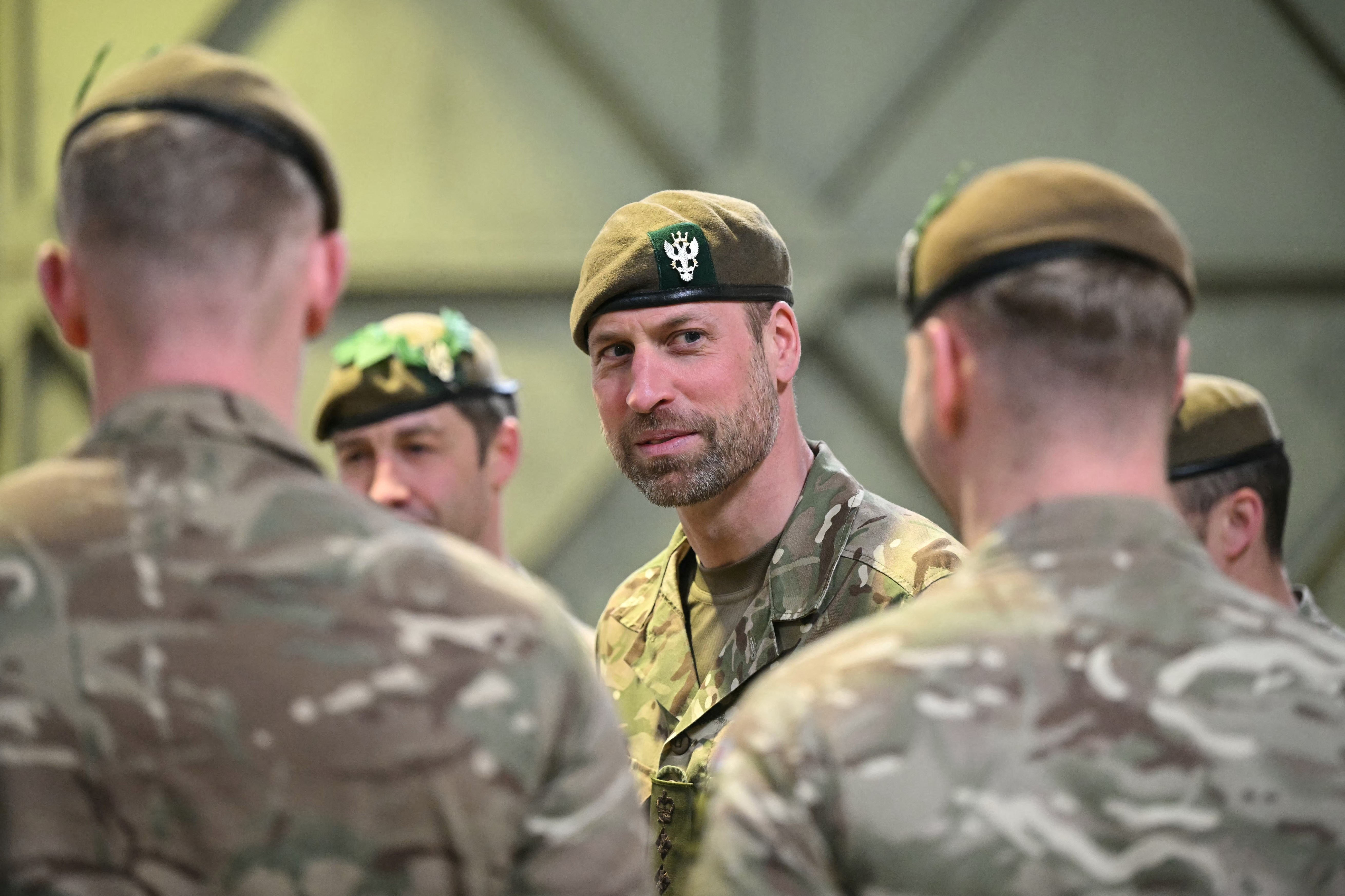 Britain's Prince William (C), Prince of Wales as Colonel-in-Chief of the Regiment, meets with soldiers of the 1st Battalion Mercian Regiment in Bulford in south-west England on March 26, 2026. (Photo by JUSTIN TALLIS / POOL / AFP)