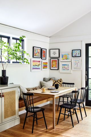 family dining room with wooden table and black chairs