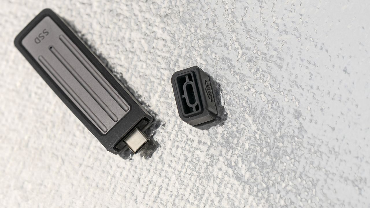 Seagate Ultra Compact SSD on a glass background.