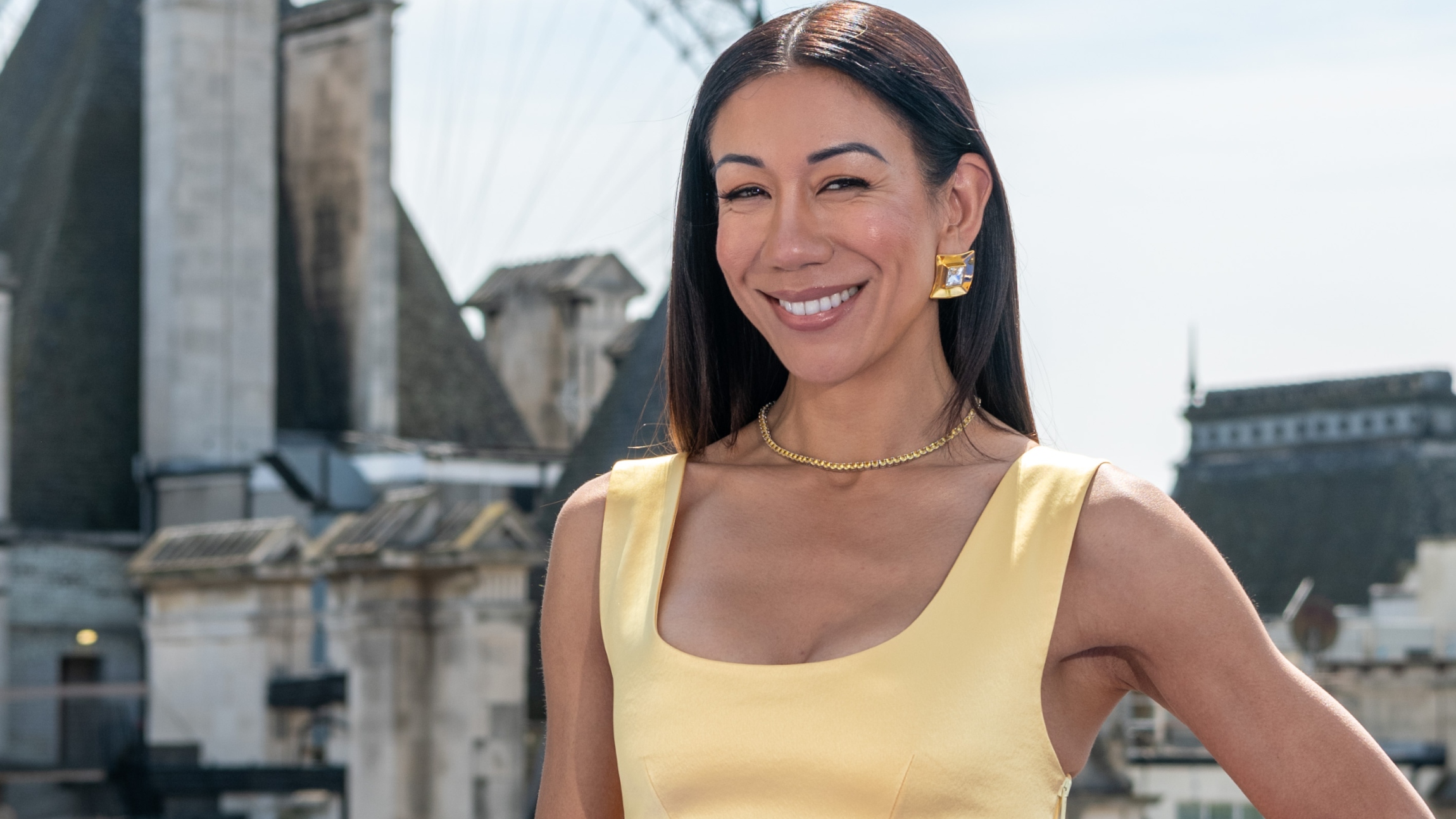Nessie from The Real Housewives of London with the city skyline behind her.