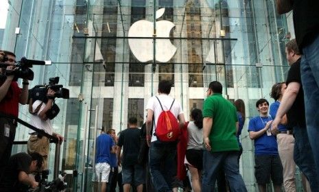 People wait in line for the iPhone 4 in New York City in 2010