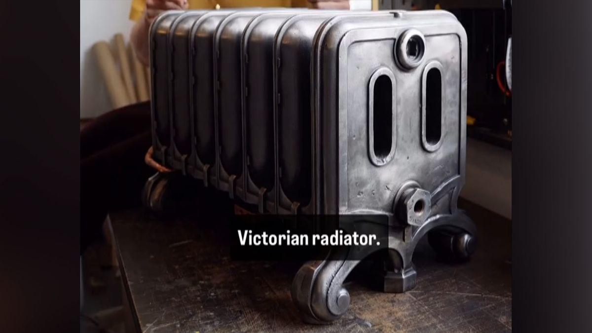 110-pound cast-iron Victorian radiator upcycled into a gaming PC — massive radiator used for cooling the bottom-mounted PC components