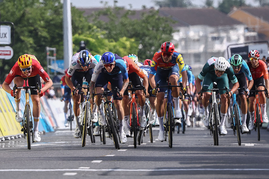 Israel - Premier Tech's British rider Thomas Jake Stewart (C) cycles to the finish line to win the 5th stage of the 77th edition of the Criterium du Dauphine cycling race, 183 km between Saint-Priest and Mâcon, on June 12, 2025. (Photo by Anne-Christine POUJOULAT / AFP) (Photo by ANNE-CHRISTINE POUJOULAT/AFP via Getty Images)