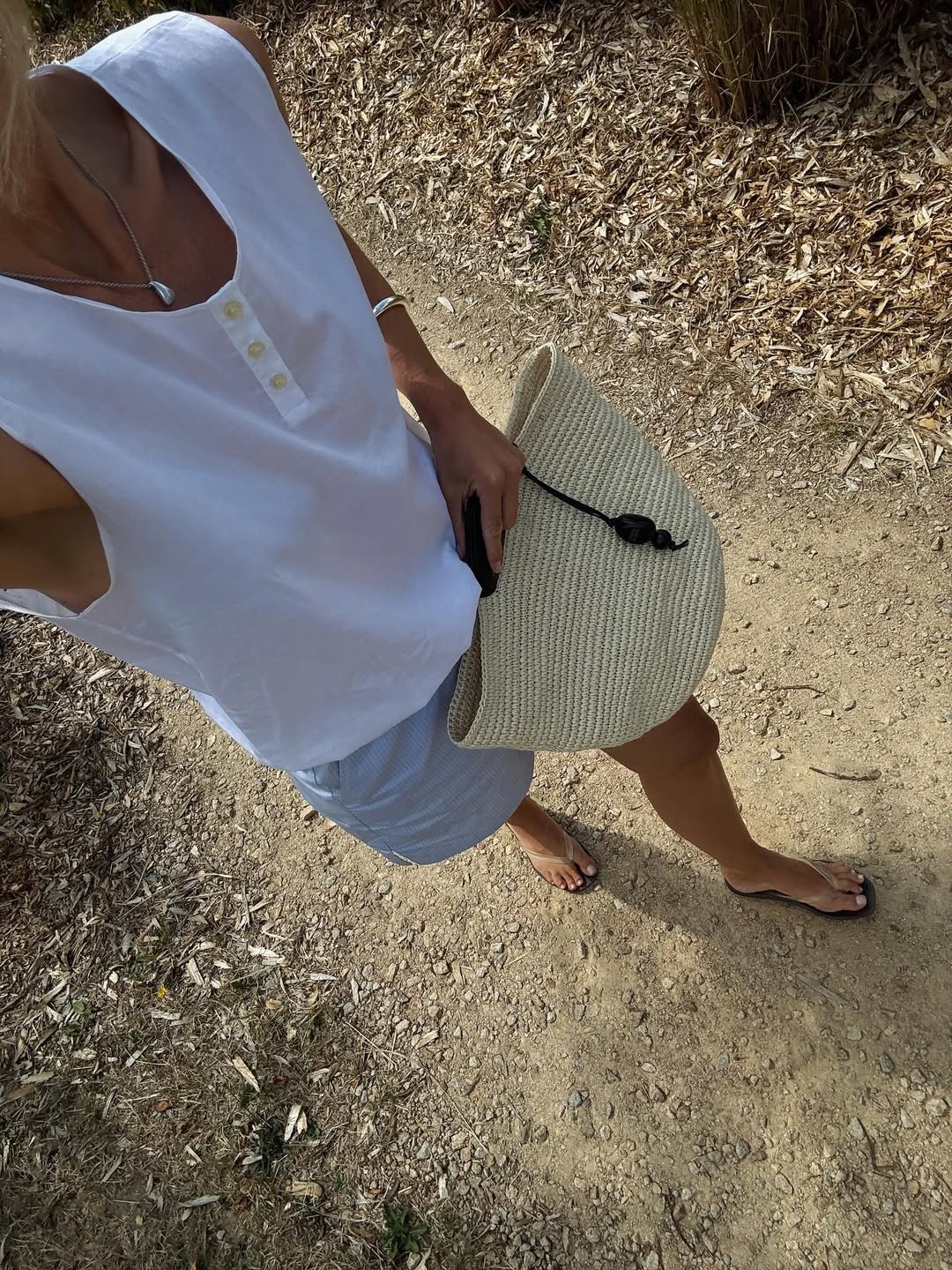 anouk yve carries a straw basket bag