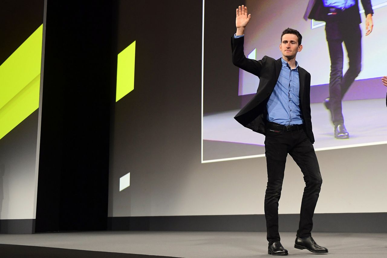 Belgian rider Tiesj Benoot walks onto the stage
