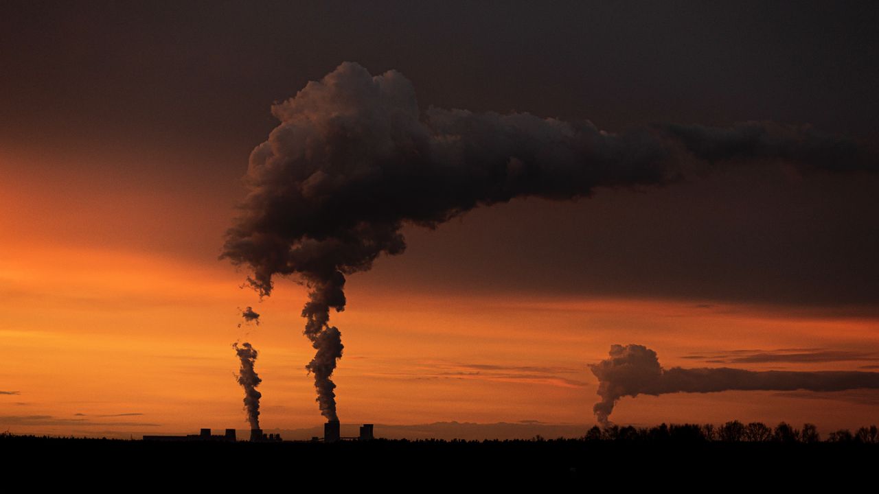 Smoke rises from two coal-fired power stations in Ober Prauske, Germany