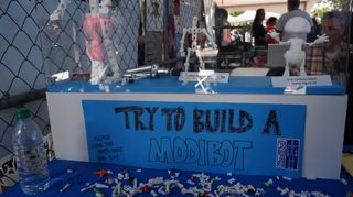 ModiBot toys are made of interlocking parts that assembly into an action figure that can wear 3D-printed accessories, shown at Maker Faire on Sept. 22, 2013.