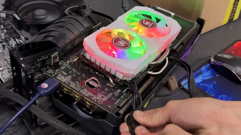 An AMD Radeon RX 580 attached to an RX 5070 Ti be a series of wires, bypassing the hole in the Nvidia card&#039;s PCB