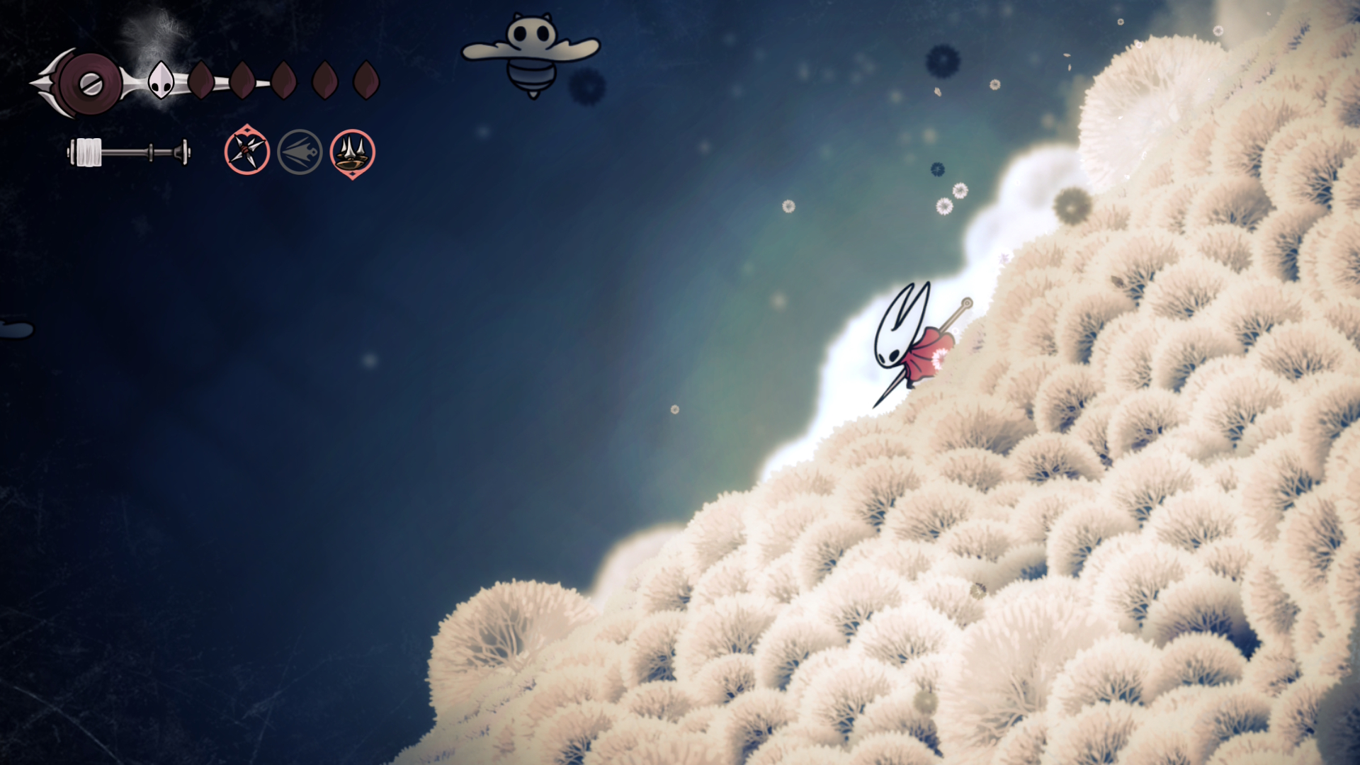 Hornet slides down a snowy hill in Hollow Knight: Silksong