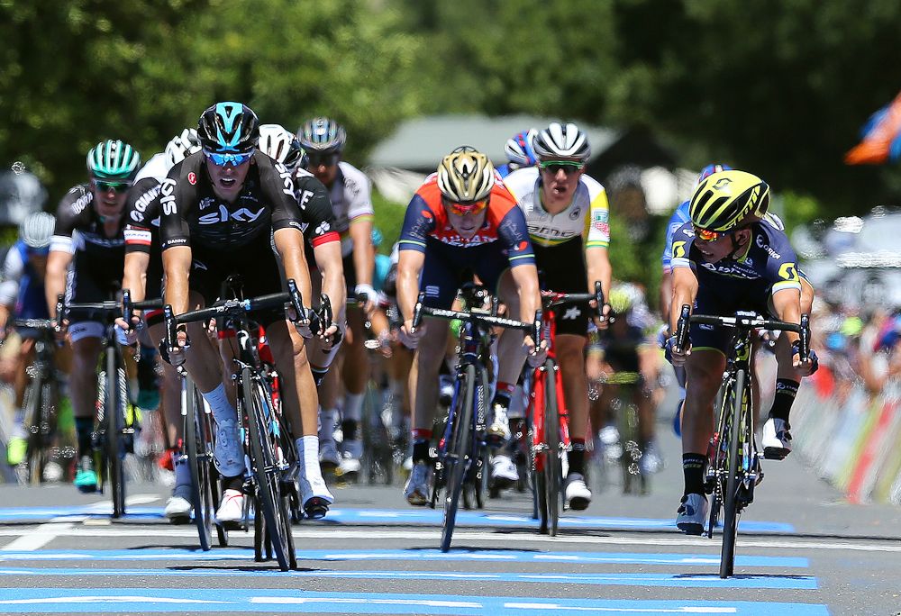 Caleb Ewan looks over at Danny van Poppel as they cross the line at Tour Down Under stage 1.