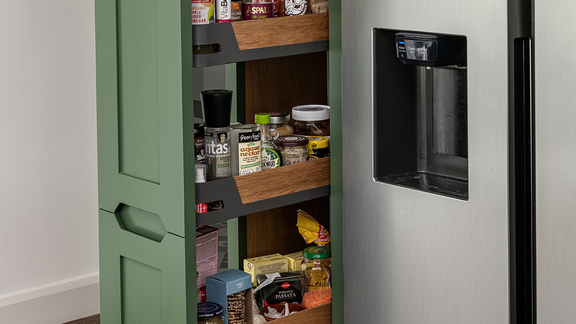 Forest green kicthen with pull-out pantry kitchen storage idea