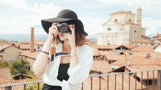 A person taking photographs on holiday.