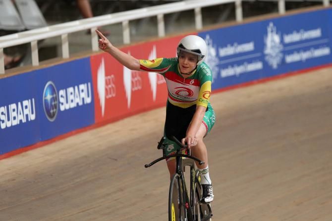 Amy Cure celebrates her 3000m Individual Pursuit title