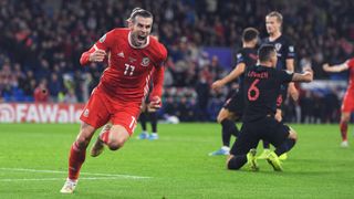 Gareth Bale of Wales(L) celebrates scoring ahead of the Euro 2024 Qualifier between Wales and Croatia