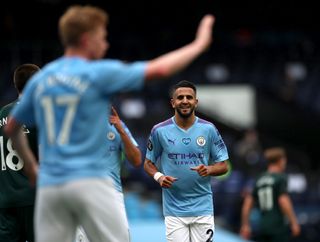 Manchester City’s Riyad Mahrez celebrates scoring his side’s second goal of the game with teammate Kevin De Bruyne (left) during the Premier League match at the Etihad Stadium, Manchester