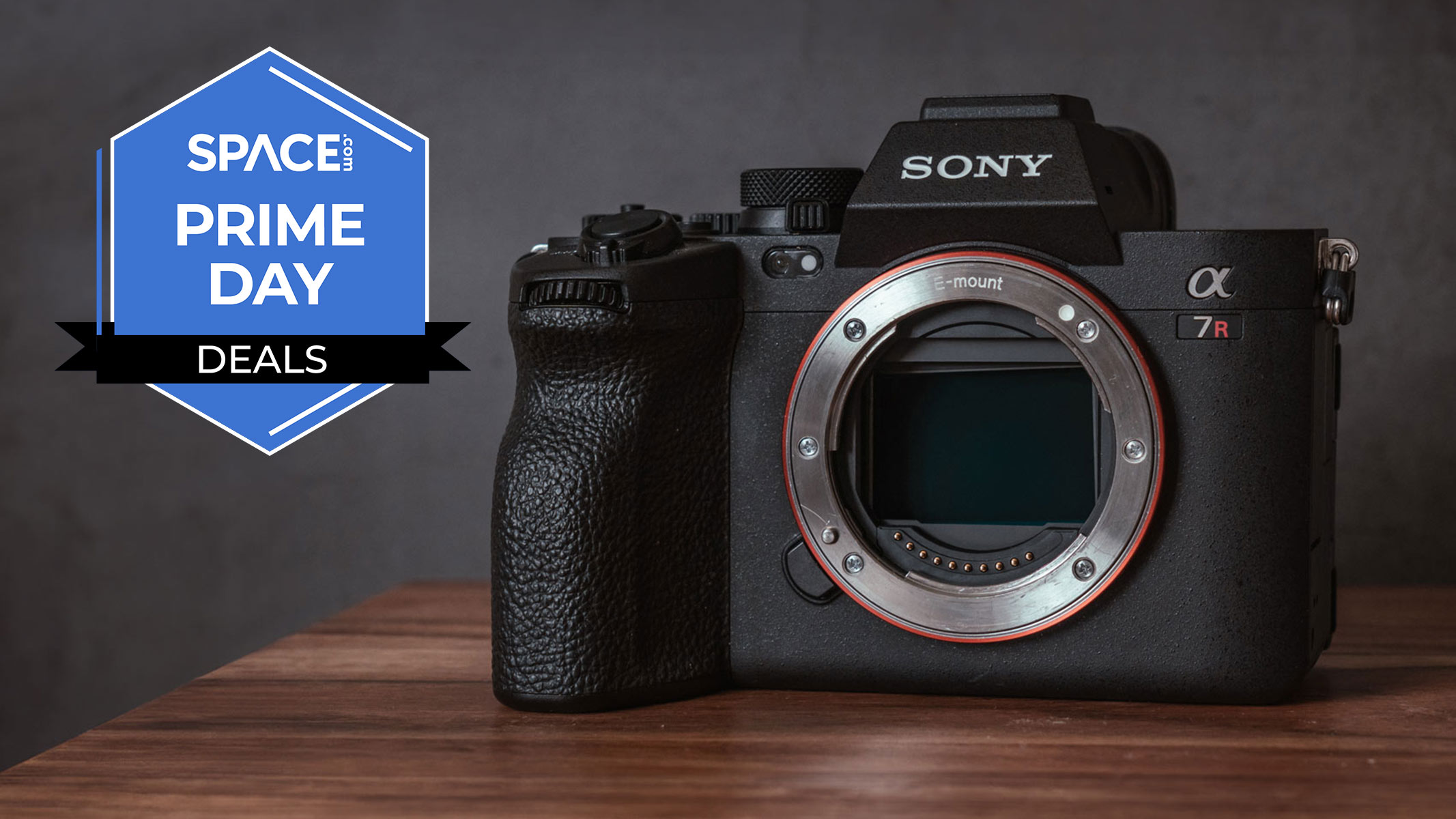 The Sony A7R on a wooden table with a blue Space.com Prime Day badge in the upper left corner.