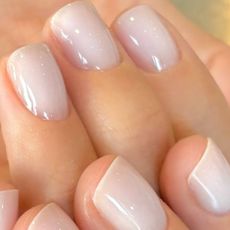 A close up of milky nails