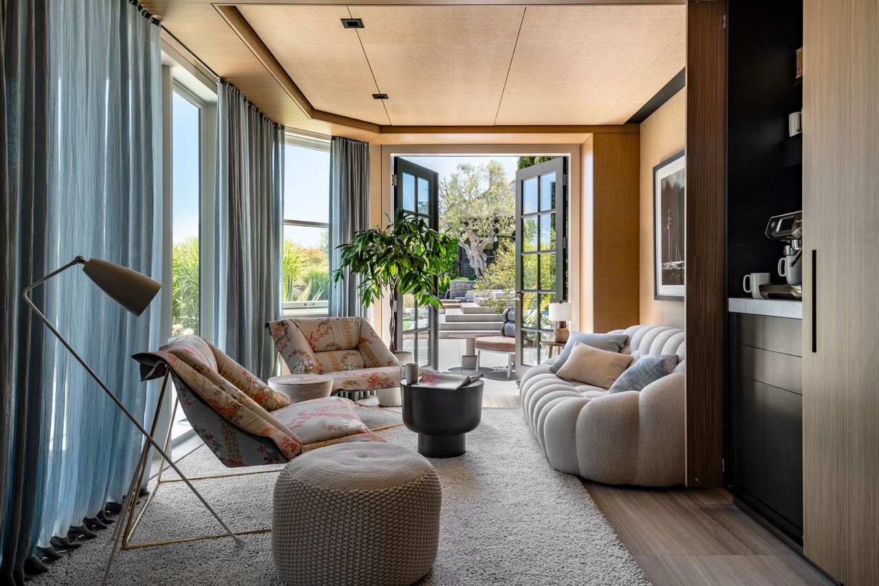 a garden room with a bubble sofa and patio doors opens