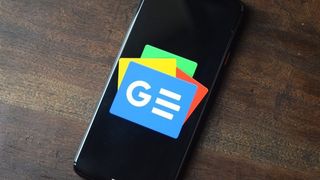 Google News logo on an Android phone kept on a wooden table