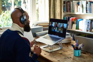 Man working from home in a team video call
