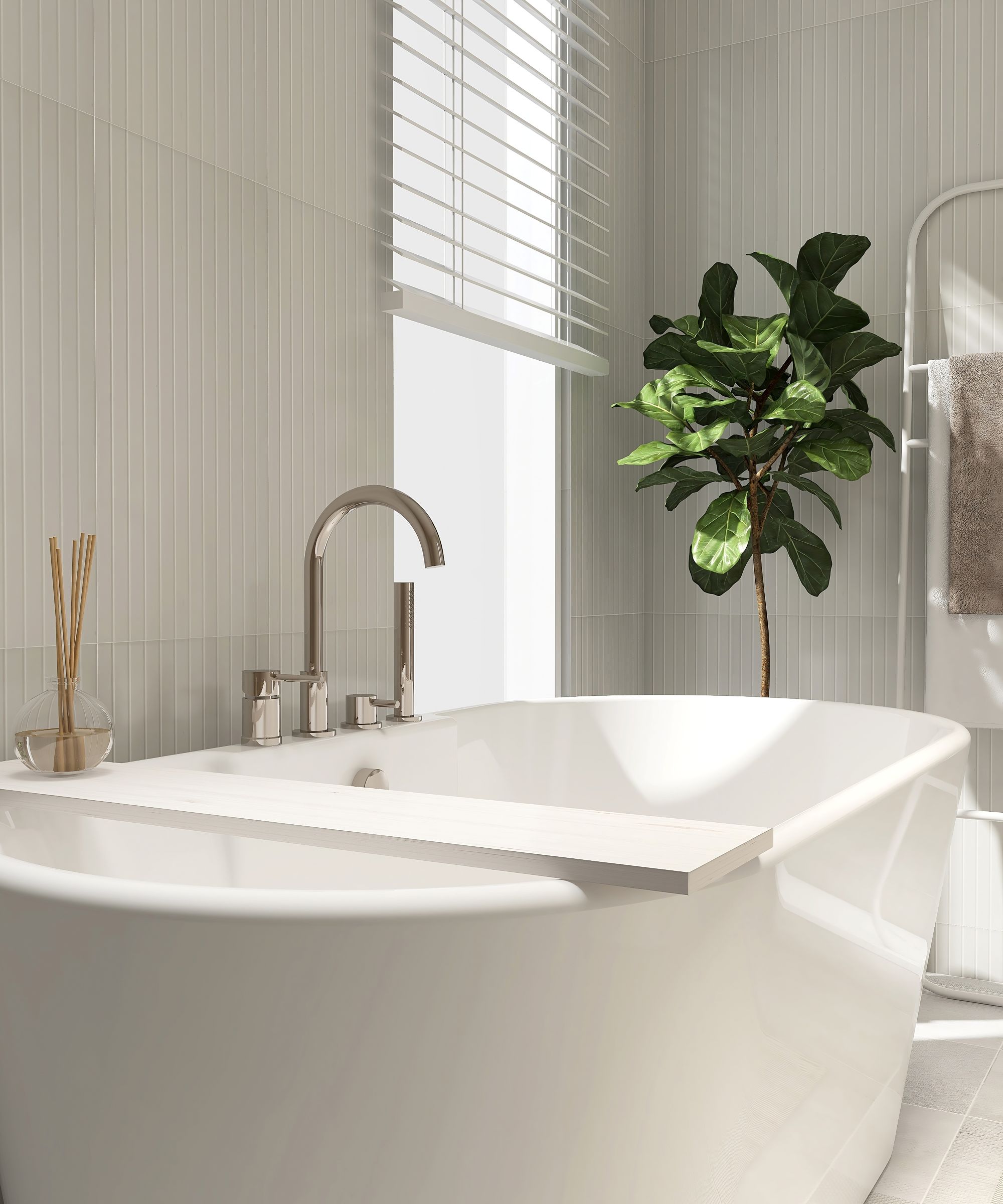 modern bathroom with a wood plank caddy tray, reed stick diffuser, freestanding bathtub