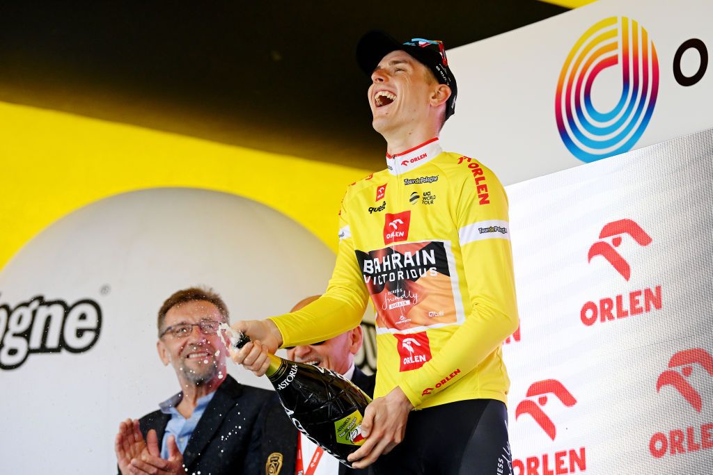 OPOLE POLAND AUGUST 01 Matej Mohoric of Slovenia and Team Bahrain Victorious celebrates at podium as Yellow leader jersey winner during the 80th Tour de Pologne 2023 Stage 4 a 1991km stage from Strzelin to Opole UCIWT on August 01 2023 in Opole Poland Photo by Dario BelingheriGetty Images