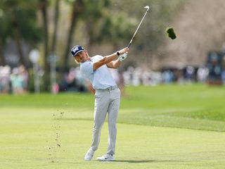 Jake Knapp after hitting an iron shot on the fairway