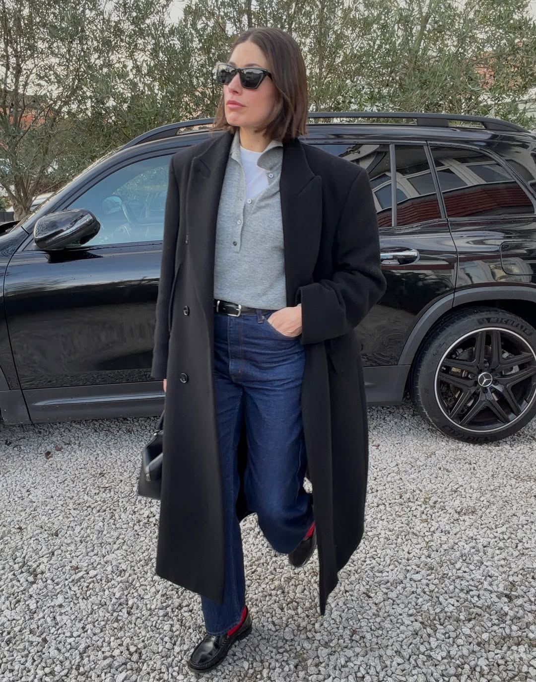 Woman wearing layering outfit idea 2026.