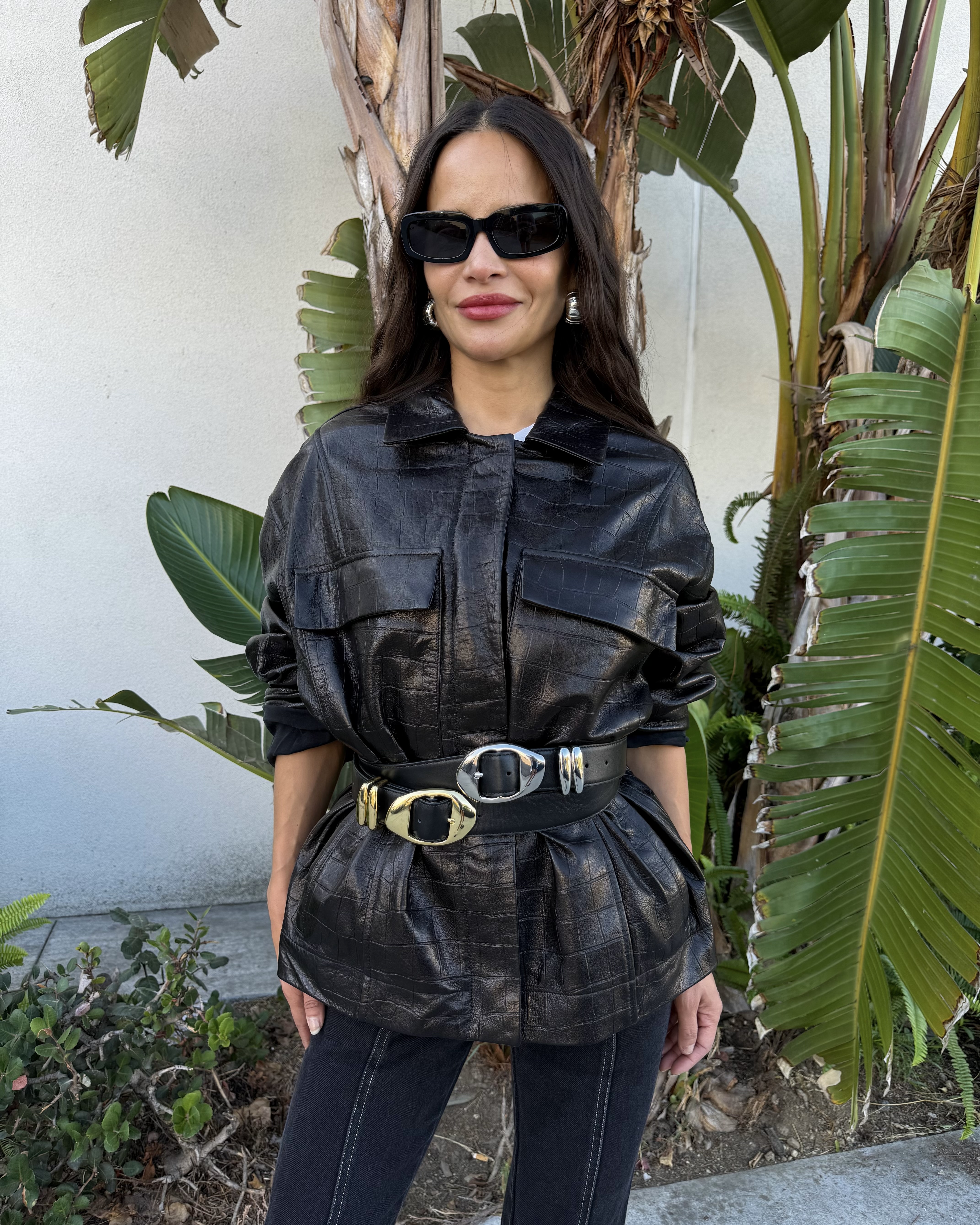 Sophie Lopez wearing a leather jacket and belts