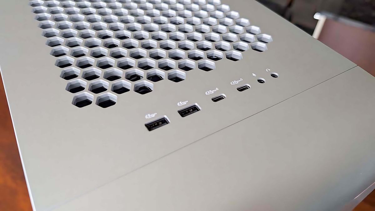 Two USB-A ports, two USB-C ports, a microphone jack, and a headphone jack on top of the Alienware Area-51 Gaming Desktop (2025).
