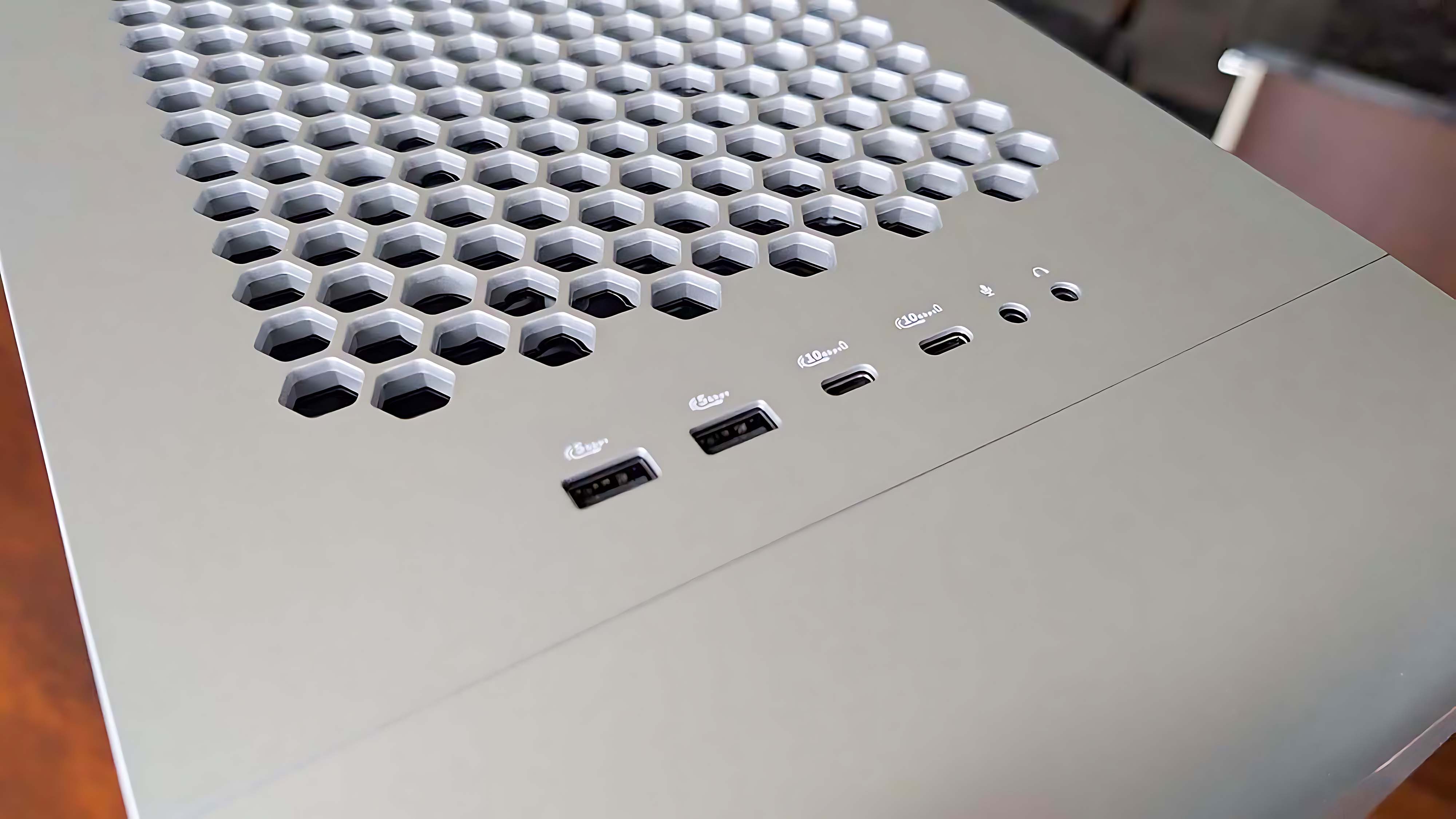 Two USB-A ports, two USB-C ports, a microphone jack, and a headphone jack on top of the Alienware Area-51 Gaming Desktop (2025).