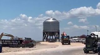 The test tank for SpaceX's Starship SN7 prototype is moved into position on its pressure test stand on June 12, 2020 at SpaceX's Boca Chica, Texas facility.