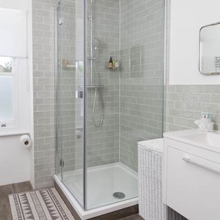 bathroom with shower and wooden flooring