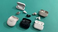 Bose, Sony, Apple and Bowers & Wolkins wireless earbuds lined up and out of their cases