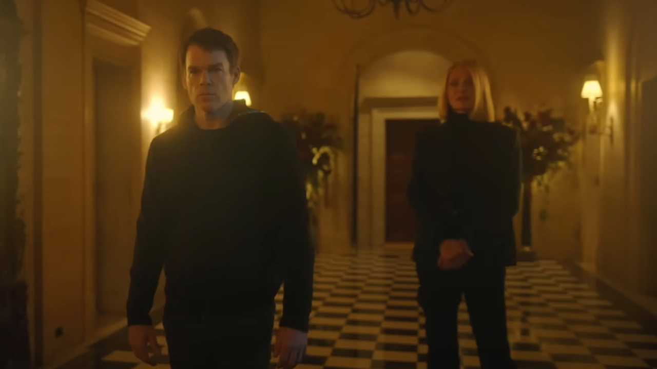 Michael C. Hall standing in front of Uma Thurman in a fancy hallway on Dexter: Resurrection