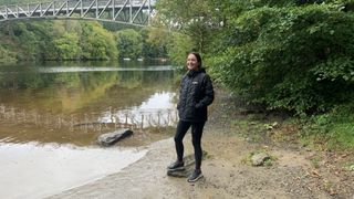 Hiker standing by the river